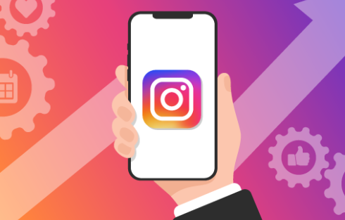 instagram on phone held by man in a suit graphic